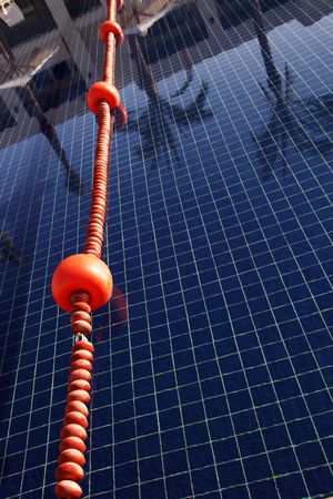 Rope with plastic anchor buoys in a swimming poolの写真素材