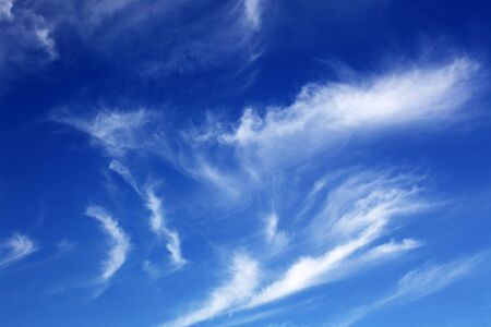 Some white clouds in the clear sky