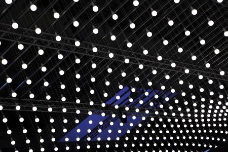 lot of light bulbs hanging on the ceilingの写真素材