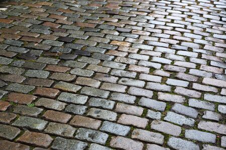 old paving stone on city roadの写真素材