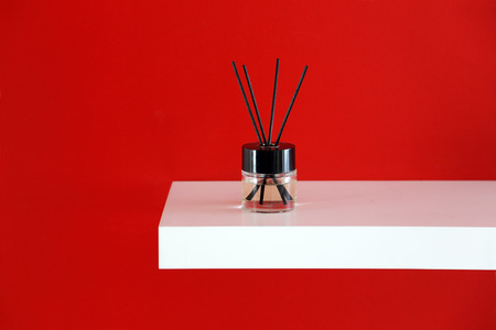 essential oil with sticks for flavoring