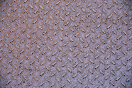 rusty metal surface with the notch in the form of a rhombus