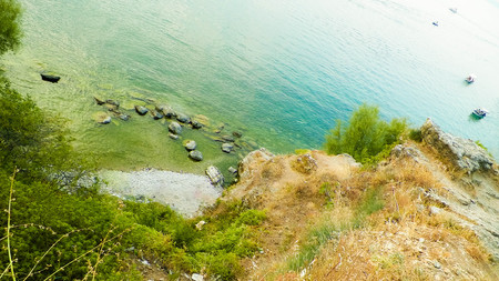 Beautiful water of Lake Ochrid as nature background. Ochrid is the oldest lake in Europe. High cliffs and mediterranean nature.の写真素材