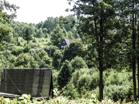 Traditional country houses and hills in Krzeszna, Kashubian Region, Poland. Travel and exploration concept.の写真素材