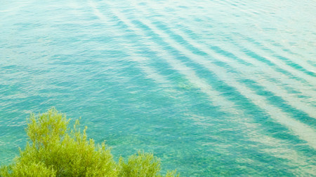 Beautiful water of Lake Ochrid as nature background. Ochrid is the oldest lake in Europe. Mediterranean nature, copy space.の写真素材