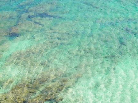 Picture of tropical Atlantic ocean water background. Transparent water and bottom of the ocean. Nature concept.の写真素材