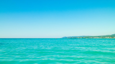Sea and coast of Vada, Italy. Transparent, turquoise water and white sand. Travel and nature concept.の写真素材