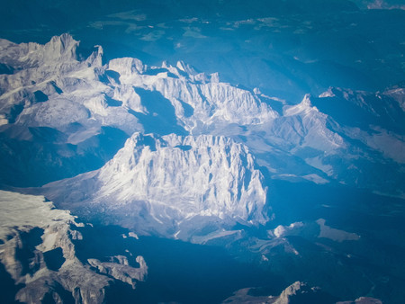 Alps, view of the mountains from the window of the plane. Land bending and nature concept.の写真素材