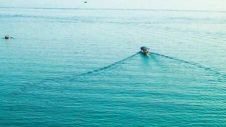 Small fishing boat on water of Ochrid Lake. Travel and nature concept.