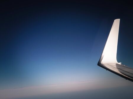 View from plane window on Planet Earth and plane wing. Travel and transport concept.の写真素材