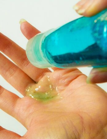 Washing hands with sanitary, disinfecting fluid. Hygiene and healthcare during Coronavirus pandemy.の写真素材