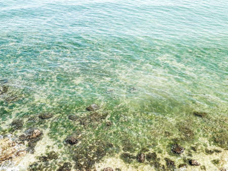 View from cliff on water of Black Sea. Beautiful transparent water of Black Sea, exploration and nature concept, Romania, Dobrogea region.の写真素材