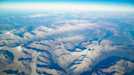 Horizon of the planet earth and Alps mountain tops. View from spaceship or plane.の写真素材