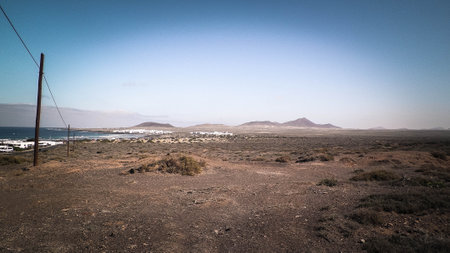 Sea coast and desert in Caleta de Famara, Lanzarote Canary Islands. Offroad exploration concept.の写真素材