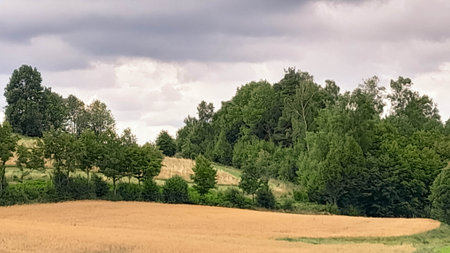 Cloudy day in Kashubia Poland. Clouds are gathering over the hills. Storm is coming. Beauty of...