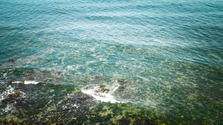 View from cliff on water of Black Sea. Beautiful transparent water of Black Sea, exploration and...