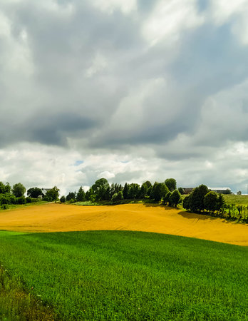 Cloudy day in Kashubia Poland. Clouds are gathering over the hills. Storm is coming. Beauty of...