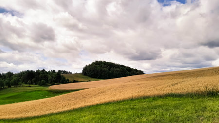 Cloudy day in Kashubia Poland. Clouds are gathering over the hills. Storm is coming. Beauty of...