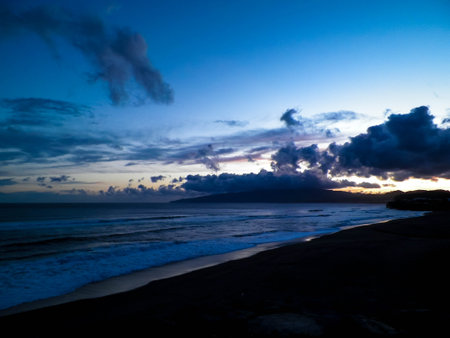 Dramatic sky after sunset over Atlantic Ocean, Ribiera Grande, Azores Islands.の写真素材