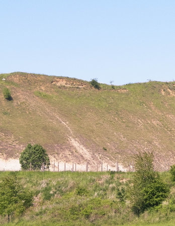Gravel pit in mining area. Northern Poland. Copy space on sky. Natural environment exploration concept.の写真素材