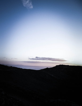 Beautiful sunset over extinct volcano Montana Roja. Montana Roja is a volcano on Lanzarote, Canary Islands. Copy space on colorful sky.の写真素材