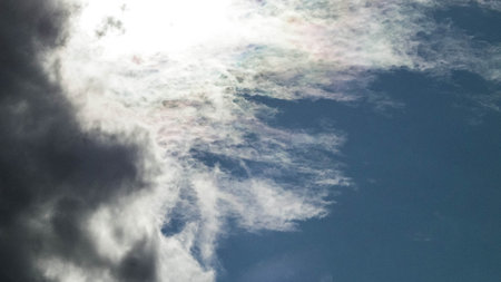 Sun hiding behind the clouds. Weather concept.の写真素材