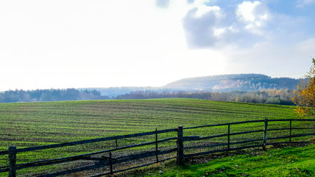 Autumnal landscape of Kashubia Region in Poland. Hills, fields and meadows.の写真素材
