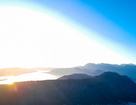 Sunny day over Lovocen Mountain tops and Kotor Bay fjords. The Lovcen Mountains lie around Boka Kotorska in Montenegro. Kotorska bay in a foreground.の写真素材