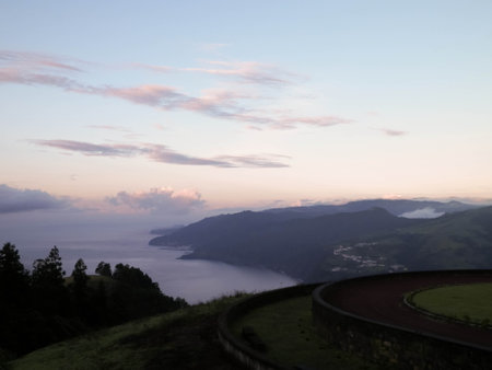Stunning sunset over coast in Sao Miguel island. Sao Miguel is the biggest island of Azores Archipelago.の写真素材