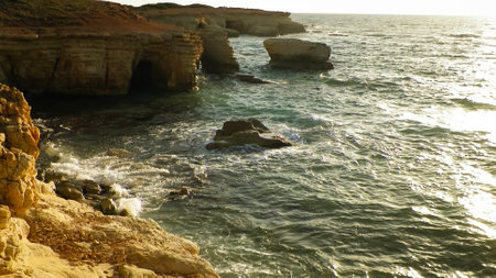 Rock formations and water caves close to Coral Bay in Paphos area on Cyprus Island. Popular touristic site. Summer season.の写真素材
