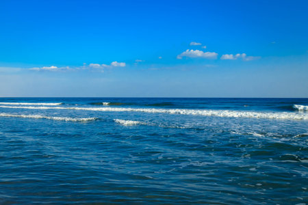 Beautiful seascape with clear blue sky and white clouds.の写真素材