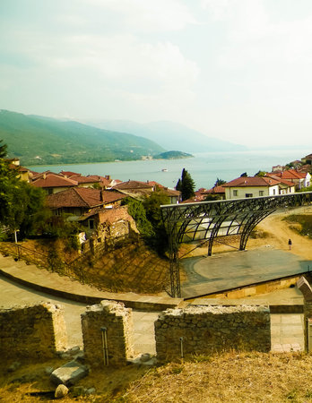 Old town in Ochrid City, amphitheater and water of Ochrid Lake as background. Architecture and tourism concept. Ohrid is one of only 28 sites that are part of UNESCO's World Heritage that are Cultural as well as Natural sites.の写真素材