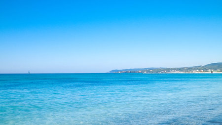 Coast and beach in Vada, Italy. Transparent, turquoise water and white sand. Travel and nature concept.の写真素材