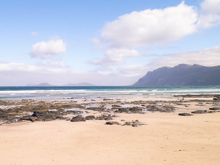 Caleta de Famara beach on the island of Lanzarote. Canaries. An iconic place among surfers.の写真素材