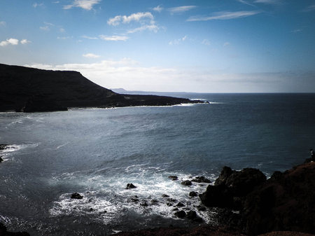 Cliffs over El Golfo Beach. Lanzarote Island. Popular touristic attraction.の写真素材
