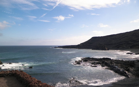Cliffs over El Golfo Beach. Lanzarote Island. Popular touristic attraction.の写真素材