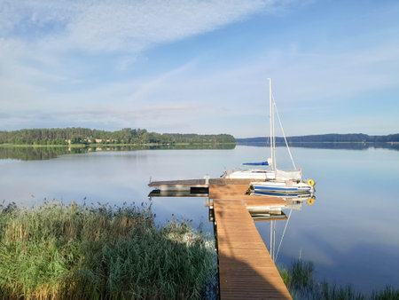 Boat in marina on Wdzydzkie Lake at sunny day. Beautiful nature of Kashubia.の写真素材