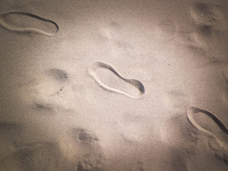 Travelers footstep on beach or desert. Natural background.の写真素材