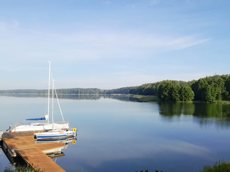 Boat in marina on Wdzydzkie Lake at sunny day. Beautiful nature of Kashubia.の写真素材