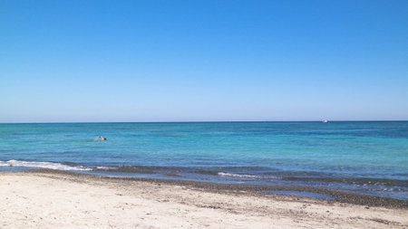 Sandy beach in Vada, transparent, turquoise water and white sand. Travel and nature concept.の写真素材