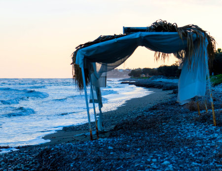 Coast of tropical Perivolia beach in Cyprus at sunset.の写真素材