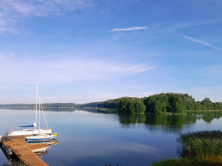 Boat in marina on Wdzydzkie Lake at sunny day. Beautiful nature of Kashubia.の写真素材