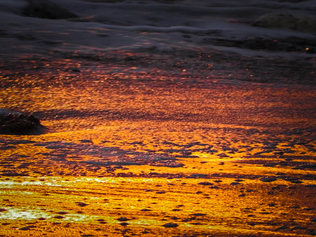 Sun rays reflecting on the water surface. Natural background.の写真素材