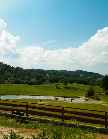 Idyllic landscape of kashubian village. Pastures, fields, and meadows.の写真素材
