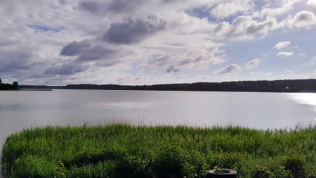 Moody sky over Wdzydzkie Lake. Incoming rain.の写真素材