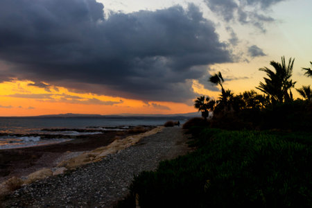 Coast of tropical Perivolia beach in Cyprus at sunset.の写真素材