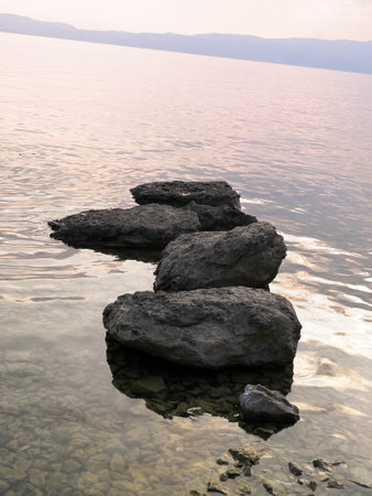 Stones on Ohrid Lake shore as nature background. Nature and travel concept.の写真素材
