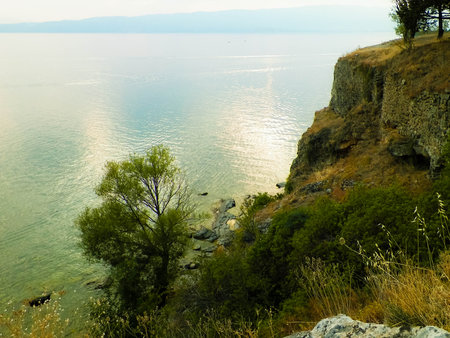 Beautiful water of Lake Ohrid as nature background. Ohrid is the oldest lake in Europe. High cliffs and mediterranean nature.の写真素材