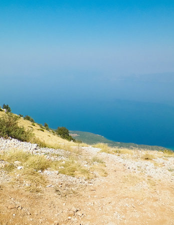 View from top of mountains in Galicica National Park, Macedonia. Galicica is National Park between two lakes - Ohrid and Prespa Lake, known for its wild nature. Offroad in Macedonia, Balkan nature and exploration concept. Copy space.の写真素材