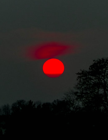Beauty of nature. Red moon on dark sky. Amazing natural phenomenom.の写真素材